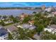Drone shot of a waterfront community, with the subject property showing a screened pool and close to all the downtown area has to offer at 45 Adalia Ave, Tampa, FL 33606