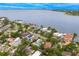 Expansive aerial captures the stunning waterfront residences and their enviable location in a desirable waterside community at 45 Adalia Ave, Tampa, FL 33606