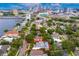 Exceptional aerial of a home with a screened pool, outlined to highlight the property's boundaries in the lush neighborhood setting at 45 Adalia Ave, Tampa, FL 33606