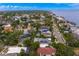A wide aerial captures waterfront properties with stunning water views and luxurious amenities, complete with well-kept gardens and landscaping at 45 Adalia Ave, Tampa, FL 33606