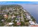 Breathtaking aerial view of waterfront homes, lush landscaping, and tranquil bay waters in this desirable neighborhood at 45 Adalia Ave, Tampa, FL 33606