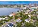 Scenic aerial showcasing waterfront properties and their proximity to the downtown area, all while having plenty of privacy with mature trees at 45 Adalia Ave, Tampa, FL 33606