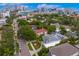Stunning aerial view of a property featuring mature trees, a screened pool, and a well manicured front yard with beautiful curb appeal at 45 Adalia Ave, Tampa, FL 33606
