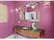Chic powder room with marble vanity, ornate mirror, and stylish wall sconces at 45 Adalia Ave, Tampa, FL 33606