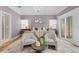 Well-lit bedroom boasts a large bed, seating area, and natural light, creating a serene and inviting ambiance at 45 Adalia Ave, Tampa, FL 33606