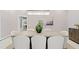 Dining room showcasing an oversized table, pendant lighting, and neutral décor at 45 Adalia Ave, Tampa, FL 33606
