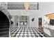 Grand foyer featuring high ceilings, a stunning chandelier, and black and white flooring at 45 Adalia Ave, Tampa, FL 33606