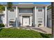 Home exterior showcasing white columns, front door, and manicured landscaping at 45 Adalia Ave, Tampa, FL 33606