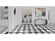 Hallway view into the dining room showcasing the black and white checkered flooring at 45 Adalia Ave, Tampa, FL 33606