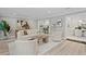 Bright living room with hardwood floors, stylish decor, and an open doorway to the kitchen at 45 Adalia Ave, Tampa, FL 33606
