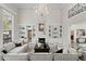 Open-concept living room featuring soaring ceilings, a fireplace, and built-in bookshelves at 45 Adalia Ave, Tampa, FL 33606