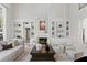 Elegant living room with a fireplace, built-in bookshelves, and a chandelier at 45 Adalia Ave, Tampa, FL 33606