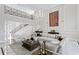 Elegant living room with a fireplace, built-in bookshelves, and a chandelier at 45 Adalia Ave, Tampa, FL 33606