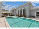 Stunning pool area with an attached spa and outdoor lounge, perfect for relaxation and entertaining at 45 Adalia Ave, Tampa, FL 33606