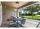 Relaxing screened patio with table and chairs at 8048 Sanguinelli Rd, Land O Lakes, FL 34637