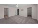 Spacious bedroom with carpet, ceiling fan, and walk-in closet at 10985 Brightleaf Ct, Riverview, FL 33569