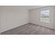 Well-lit bedroom featuring carpeted floors and a window with blinds at 10985 Brightleaf Ct, Riverview, FL 33569