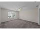 Large bedroom with carpeted floors and ceiling fan at 10985 Brightleaf Ct, Riverview, FL 33569