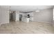 Open floor plan with kitchen, dining, and living areas at 10985 Brightleaf Ct, Riverview, FL 33569