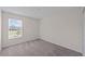 Spacious bedroom with carpeted floors and large window at 10985 Brightleaf Ct, Riverview, FL 33569