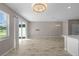 Spacious living room with sliding doors leading to the backyard at 10985 Brightleaf Ct, Riverview, FL 33569
