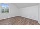 Cozy bedroom with wood-look floors and a window at 10209 Summerview Cir, Riverview, FL 33578