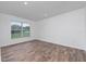 Bright bedroom with wood-look floors and a large window at 10209 Summerview Cir, Riverview, FL 33578