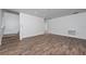 Spacious living area with wood-look floors and ample natural light, perfect for relaxing at 10209 Summerview Cir, Riverview, FL 33578