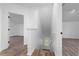 Upstairs hallway with wood-look floors and access to bedrooms at 10209 Summerview Cir, Riverview, FL 33578
