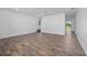 Bright living room features wood-look flooring and neutral walls, creating a spacious feel at 10209 Summerview Cir, Riverview, FL 33578