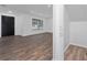 Bright and airy living room with wood-look floors and large window at 10209 Summerview Cir, Riverview, FL 33578