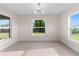Bright dining room with large windows and light flooring at 10061 Gulfstream Blvd, Englewood, FL 34224