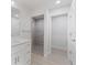 Bathroom features a walk-in shower with pebble floor at 10061 Gulfstream Blvd, Englewood, FL 34224