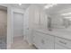Modern bathroom with white cabinets and quartz countertops at 10061 Gulfstream Blvd, Englewood, FL 34224