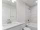 Clean bathroom, featuring a white vanity, bathtub, and shower at 10061 Gulfstream Blvd, Englewood, FL 34224