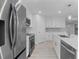Stainless steel appliances and white shaker cabinets in kitchen at 10061 Gulfstream Blvd, Englewood, FL 34224