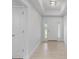 Bright and airy entryway with light wood flooring at 10061 Gulfstream Blvd, Englewood, FL 34224