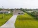 New construction home with a large backyard and paved driveway at 10061 Gulfstream Blvd, Englewood, FL 34224