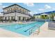 Resort-style pool with lounge chairs and a clubhouse at 1029 Seagrape Dr, Ruskin, FL 33570
