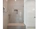 Modern shower with built-in seat and glass enclosure at 1029 Seagrape Dr, Ruskin, FL 33570