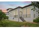 Well-maintained house exterior with a covered patio and landscaping at 1029 Seagrape Dr, Ruskin, FL 33570