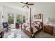 Spacious bedroom with a post bed and home office at 1029 Seagrape Dr, Ruskin, FL 33570