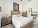 Guest bedroom with a comfortable bed and mounted TV at 1029 Seagrape Dr, Ruskin, FL 33570