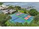 Aerial view of community tennis and pickleball courts near waterfront at 1029 Seagrape Dr, Ruskin, FL 33570