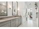 Double vanity bathroom with gray cabinets at 1029 Seagrape Dr, Ruskin, FL 33570