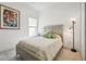 Bedroom with a queen bed and tropical decor at 1029 Seagrape Dr, Ruskin, FL 33570