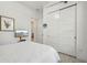 Bedroom with white sliding doors and a comfortable bed at 1029 Seagrape Dr, Ruskin, FL 33570
