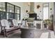 Outdoor kitchen with grill and fire pit on a brick patio at 1029 Seagrape Dr, Ruskin, FL 33570