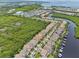 Aerial view of waterfront community with many homes at 1029 Seagrape Dr, Ruskin, FL 33570