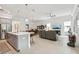 Modern kitchen with gray cabinets, a large island, and stainless steel appliances at 1029 Seagrape Dr, Ruskin, FL 33570